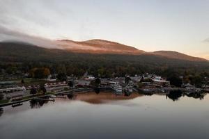 Lake George, New York - October 10, 2021, Tourist boats in the bay in Lake George, New York at dawn.