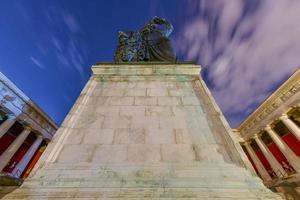 Munich, Germany - Jul 19, 2021, Bavaria Statue and Ruhmeshalle  Hall of Fame  in Munich, Germany, Theresienwiese at night. The statue was built in 1850. photo