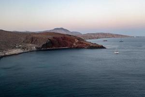 Red beach in Santorini, Cycladic Islands, Greece in the South Aegean. Beautiful summer landscape with one of the most famous beaches in the world. photo