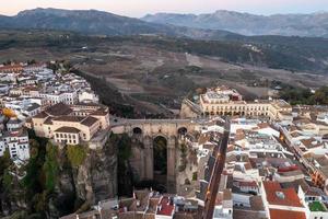 Rocky landscape of Ronda city with Puente Nuevo Bridge and buildings, Andalusia, Spain photo