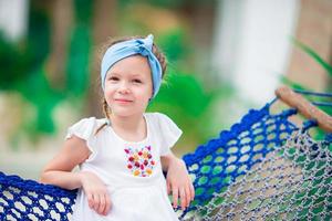 Cute little girl on the hammock photo