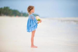 Beautiful little girl on the beach photo