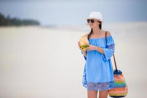 Beautiful young woman on the beach photo