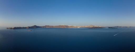 View of the cliffs of Thirasia in the caldera of Santorini, Cyclades islands, Greece, Europe photo