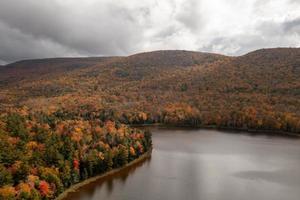 Colgate Lake in Upstate New York during peak fall foliage season. photo