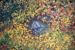 Aerial view of peak fall foliage in Keene, New York in upstate New York. photo