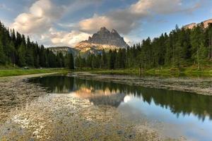 Summer view of Lake Antorno  Lago di Antorno  located in Dolomites area, Belluno Province, Italy. Lake Antorno, Three Peaks of Lavaredo, Lake Antorno and Tre Cime di Lavaredo, Dolomites, Italy. photo