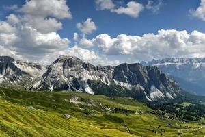 Morning view of the Gardena valley in Dolomite mountains. Location Puez-Geisler National Park, Seceda peak, Italy, Europe. Odle group is the landmark of Val di Funes. photo