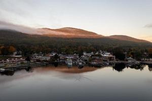 Lake George, New York - October 10, 2021, Tourist boats in the bay in Lake George, New York at dawn.