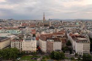 Vienna, Austria - Jul 18, 2021, View of the Danube Canal and Vienna Skyline with St. Stephen's Cathedral Vienna, Austria photo