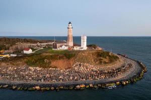 Montauk Lighthouse and beach at sunrise, Long Island, New York, USA. photo