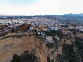 Bullring of the Royal Cavalry of Ronda aerial view at sunrise in Spain. photo