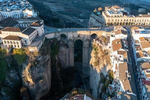 Rocky landscape of Ronda city with Puente Nuevo Bridge and buildings, Andalusia, Spain photo