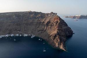 View of the cliffs of Thirasia in the caldera of Santorini, Cyclades islands, Greece, Europe photo