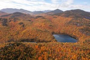 Aerial view of peak fall foliage in Keene, New York in upstate New York. photo