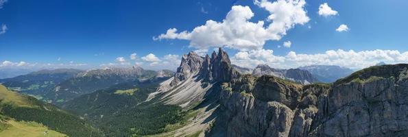 Morning view of the Gardena valley in Dolomite mountains. Location Puez-Geisler National Park, Seceda peak, Italy, Europe. Odle group is the landmark of Val di Funes. photo