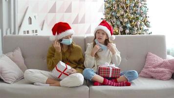 Happy kids holding christmas presents video