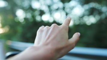 Female hand from the car window video