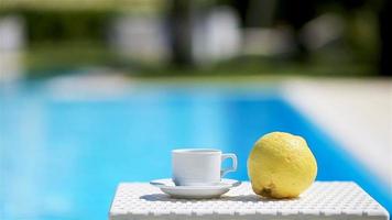 Delicious breakfast lemon, coffee, croissant by the pool video