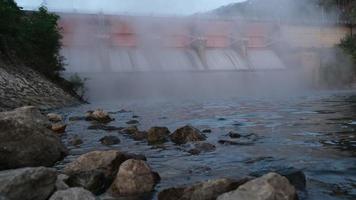 Morning scenery at Kiew Lom Dam, Lampang, Thailand. Hydroelectric dam, floodgate with water flowing through the gate. Dam with hydroelectric power plant and irrigation. video