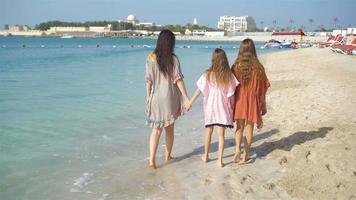 Mother and little daughters at tropical beach video