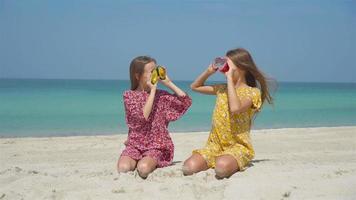 Cute little girls at beach during summer vacation video