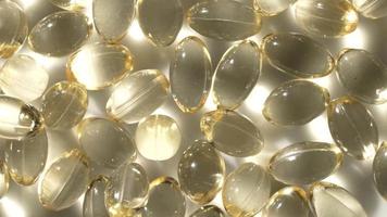 vitamines d, capsules omega 3, macro video