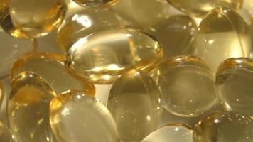 Vitamins D, capsules omega 3, macro video