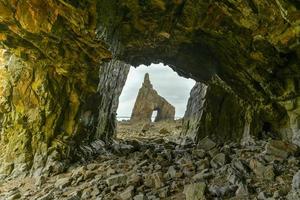 The Campiecho beach is located in Asturias, Spain on a cloudy day. photo