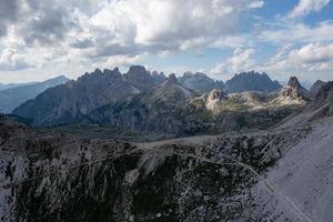 Beautiful sunny day in Dolomites mountains. View on Tre Cime di Lavaredo - three famous mountain peaks that resemble chimneys. photo