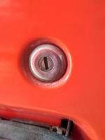 red truck car door lock photo