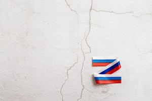 The letter Z from the Russian flag on a plaster background. Symbol of the war between Russia and Ukraine photo