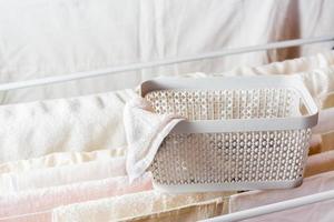 Drawer for folding towels on the clothes dryer Organization and order at home. photo