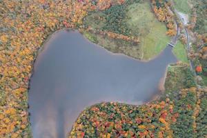 Colgate Lake in Upstate New York during peak fall foliage season. photo