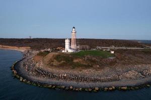 Montauk Lighthouse and beach at sunrise, Long Island, New York, USA. photo