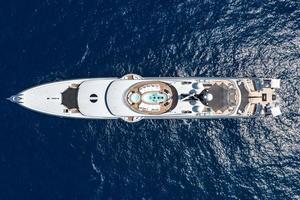 Top down view of a yacht along the coast of Capri Island on a beautiful summer day along the Amalfi Coast in Italy photo