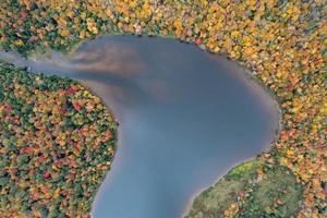 Colgate Lake in Upstate New York during peak fall foliage season. photo