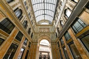 Naples, Italy - August 17, 2021, Interior view of Galleria Umberto I, a public shopping gallery in Naples, Italy. Built between 1887-1890 photo