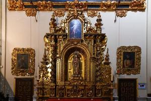 Seville, Spain - Dec 7, 2021, Rich interior of the Hospital de la Caridad Church in Seville, Spain photo