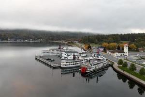 Lake George, New York - October 10, 2021, Tourist boats in the bay in Lake George, New York at dawn. photo
