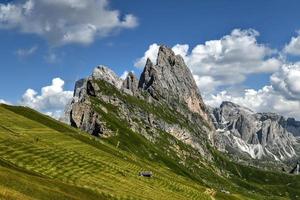 Morning view of the Gardena valley in Dolomite mountains. Location Puez-Geisler National Park, Seceda peak, Italy, Europe. Odle group is the landmark of Val di Funes. photo