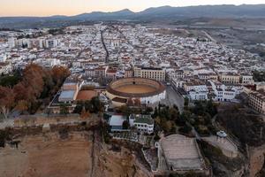 Bullring of the Royal Cavalry of Ronda aerial view at sunrise in Spain. photo