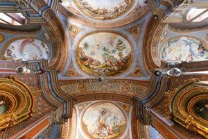 Ortisei, Italy - Aug 14, 2021, Neoclassical style Catholic Parish Church of St. Ulrich in Ortisei in Dolomites Alps in Italy. photo