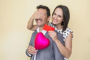 Smiling ethnic couple in love celebrating Saint Valentines Day photo