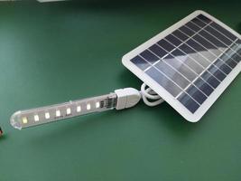 Solar battery to charge smartphone and power bank photo