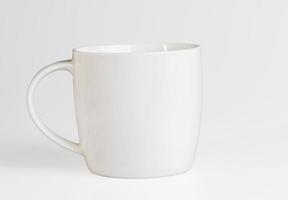 White cup on a white background. Side view. Mockup template photo