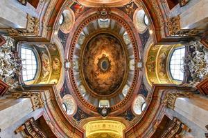 Vienna, Austria - Jul 18, 2021, The beautiful dome of St. Peter's Church  Peterskirche , a Baroque Roman Catholic parish church in Vienna, Austria. The fresco represents the Coronation of Our Lady. photo