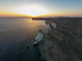 White beach in Santorini, Cycladic Islands, Greece in the South Aegean. Beautiful summer landscape with one of the most famous beaches in the world. photo