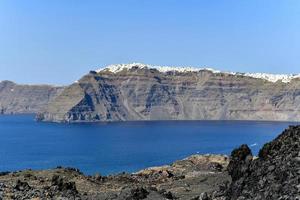 View of the island of Nea Kameni the volcano in the caldera of Santorini, Cyclades islands, Greece, Europe photo