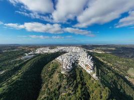 Andalusian town of Vejer de la Frontera with beautiful countryside on on a sunny day, Cadiz province, Andalusia. photo